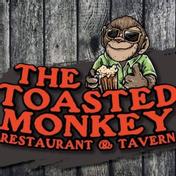 The Toasted Monkey Restaurant and Tavern logo